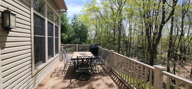 deck featuring outdoor dining area