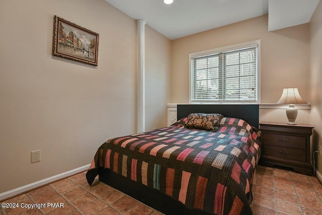 bedroom featuring baseboards