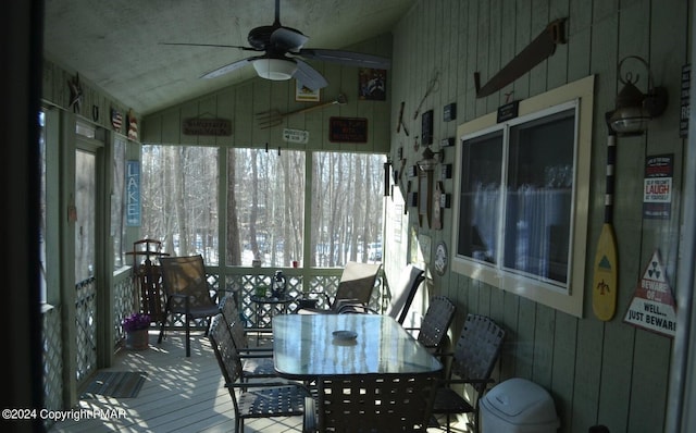 sunroom with lofted ceiling and ceiling fan