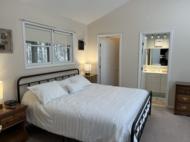 bedroom with ceiling fan, high vaulted ceiling, a skylight, and carpet flooring