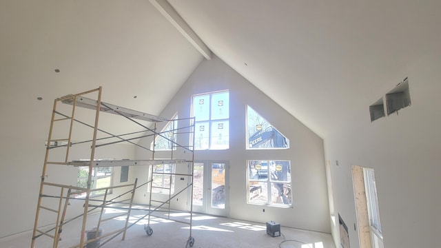 251 Bellingham Dr, Bushkill, PA 18324 - unfurnished living room featuring high vaulted ceiling and beam ceiling