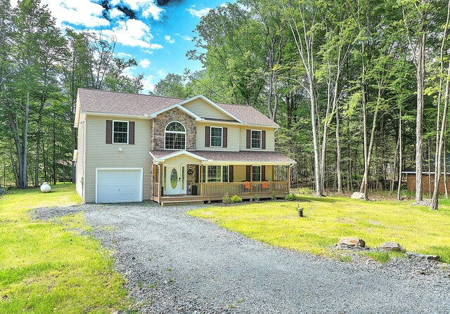 291 White Pine Dr, Pocono Lake, PA 18347 - colonial-style house featuring a porch, a garage, a front lawn, and driveway