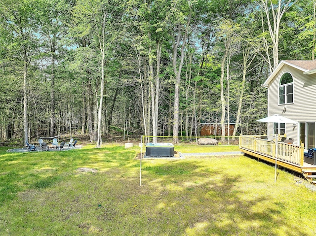 291 White Pine Dr, Pocono Lake, PA 18347 - view of yard with central air condition unit, a fire pit, and a wooden deck