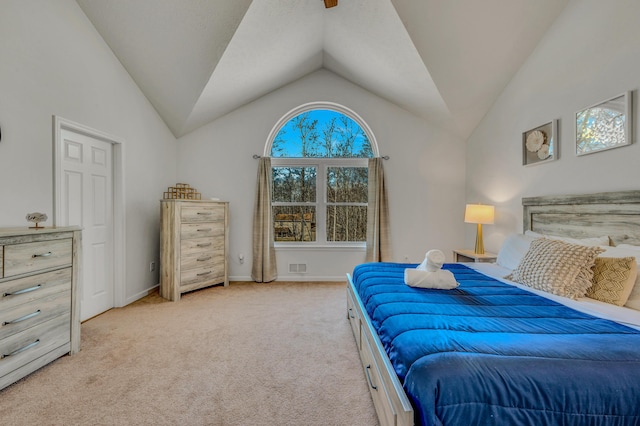 bedroom featuring multiple windows and lofted ceiling