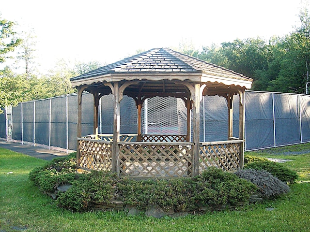 surrounding community with a gazebo and fence