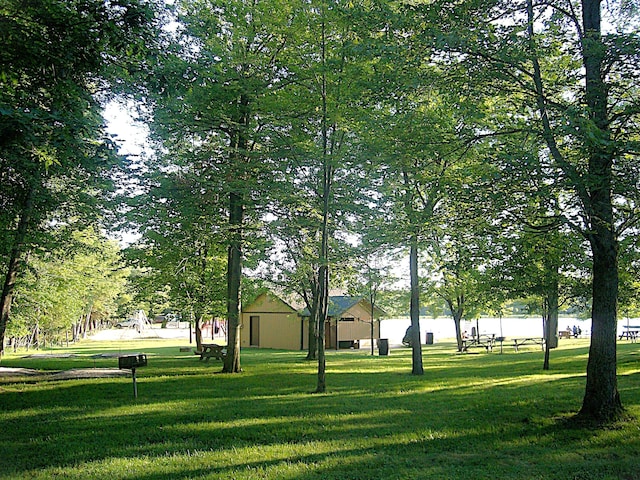 view of home's community featuring a lawn