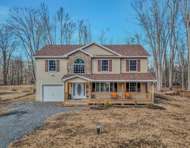 view of front facade with driveway, stone siding, a porch, a shingled roof, and a garage