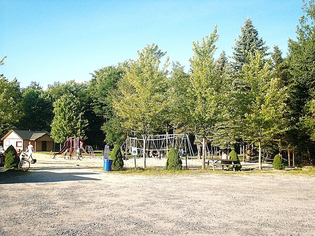 view of community with playground community and volleyball court