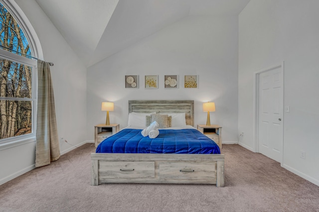 bedroom featuring baseboards, lofted ceiling, and carpet flooring