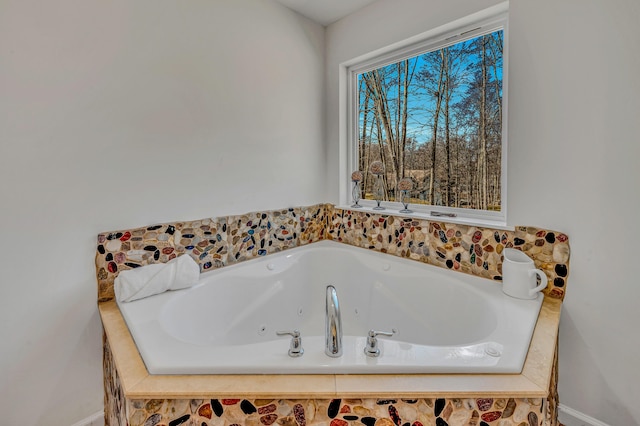 full bath featuring a jetted tub