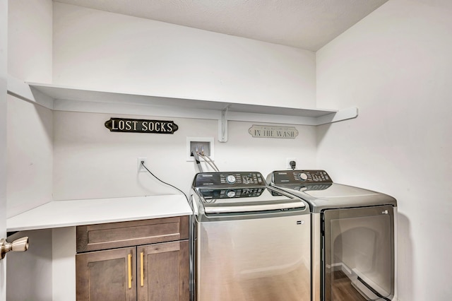 laundry area featuring cabinet space and washing machine and dryer