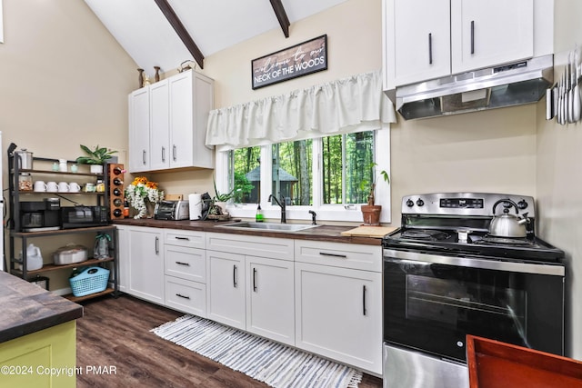 kitchen featuring white cabinetry, sink, vaulted ceiling with beams, electric range, and dark wood-type flooring