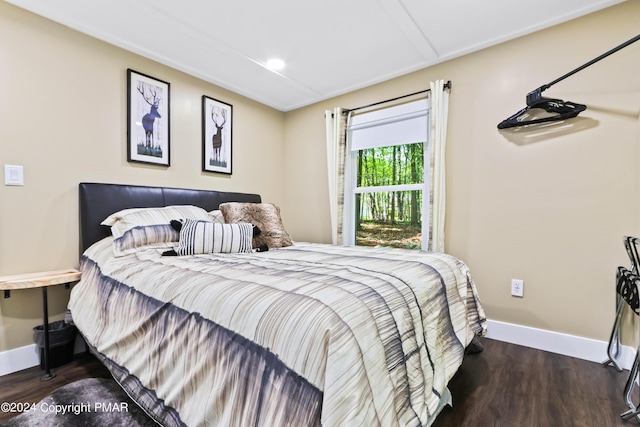 bedroom featuring dark hardwood / wood-style floors