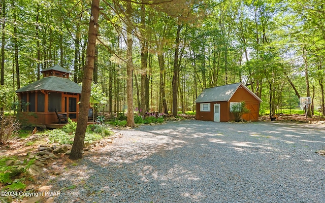 exterior space featuring a sunroom