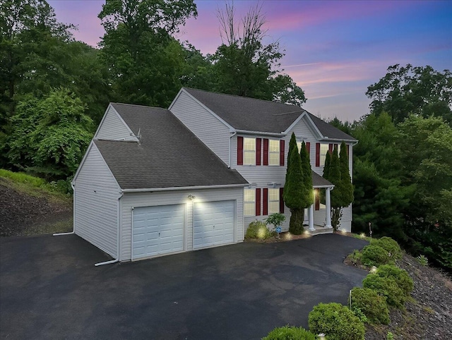 706 Franklin Ct, East Stroudsburg, PA 18302 - view of front facade with asphalt driveway, an attached garage, and a shingled roof