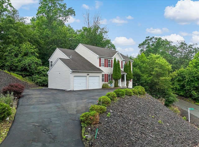 706 Franklin Ct, East Stroudsburg, PA 18302 - view of home's exterior featuring a garage and asphalt driveway
