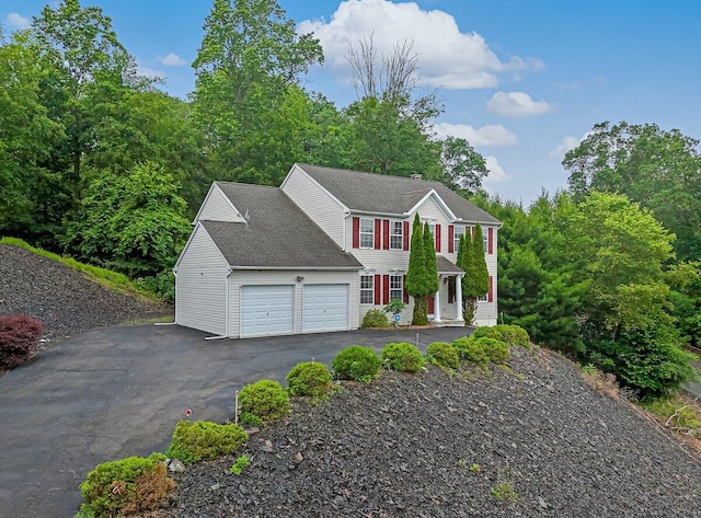 706 Franklin Ct, East Stroudsburg, PA 18302 - colonial house featuring a garage and asphalt driveway