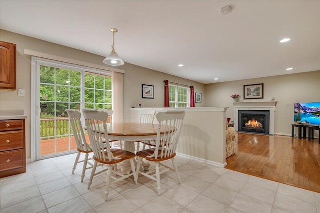 706 Franklin Ct, East Stroudsburg, PA 18302 - dining area with a glass covered fireplace, recessed lighting, and light tile patterned floors