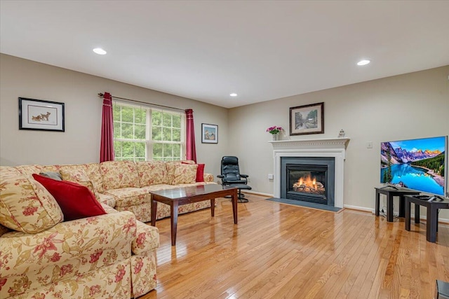 706 Franklin Ct, East Stroudsburg, PA 18302 - living area with light wood-style floors, a glass covered fireplace, and recessed lighting
