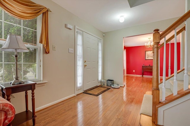 706 Franklin Ct, East Stroudsburg, PA 18302 - entrance foyer featuring light wood-style floors, stairway, and a chandelier