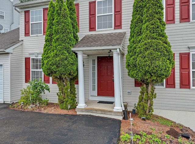 706 Franklin Ct, East Stroudsburg, PA 18302 - view of exterior entry featuring roof with shingles
