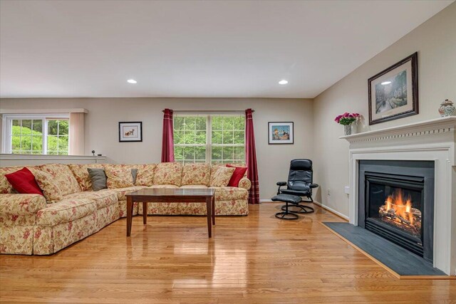 706 Franklin Ct, East Stroudsburg, PA 18302 - living area featuring light wood-type flooring, a fireplace with flush hearth, and recessed lighting
