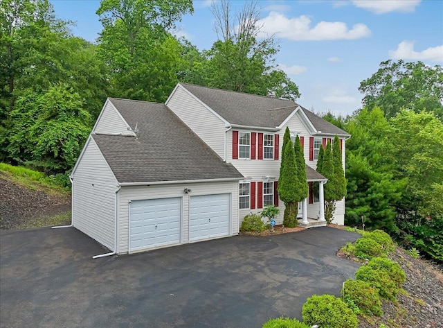 706 Franklin Ct, East Stroudsburg, PA 18302 - colonial-style house with an attached garage, driveway, and roof with shingles