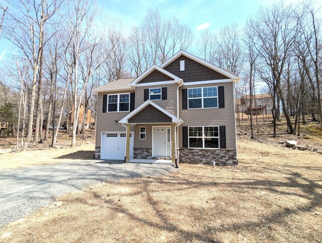 20 Leaf Ct, East Stroudsburg, PA 18302 - craftsman-style home featuring a garage, stone siding, and gravel driveway