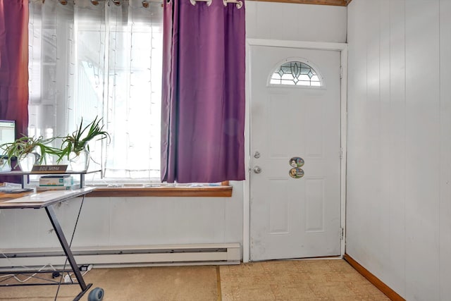 foyer featuring tile patterned floors, wood walls, and a baseboard radiator