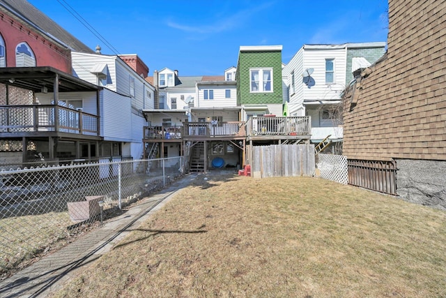 view of yard featuring a deck and fence