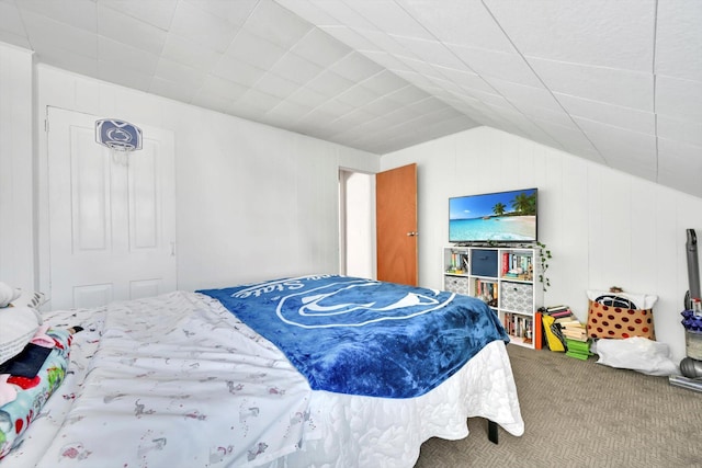 carpeted bedroom featuring vaulted ceiling