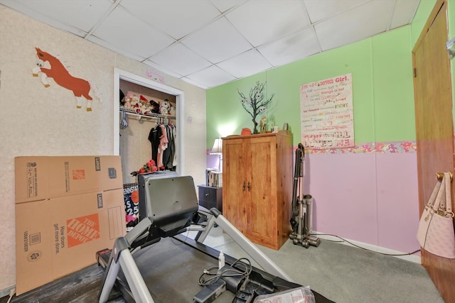 exercise room featuring a drop ceiling