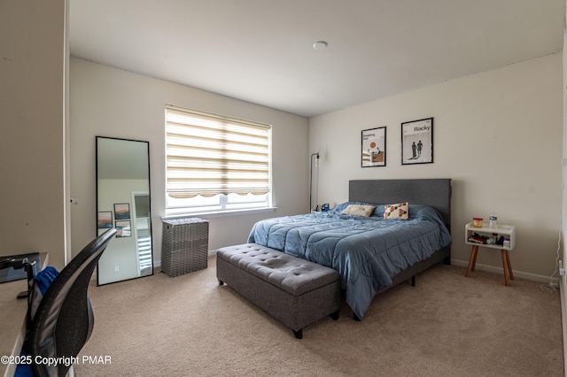 carpeted bedroom featuring baseboards