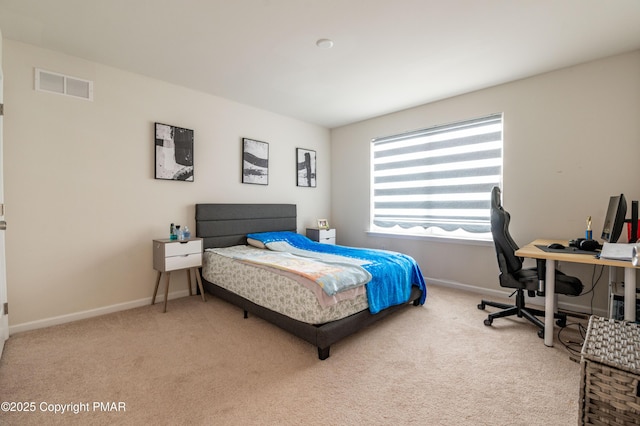 carpeted bedroom featuring baseboards and visible vents