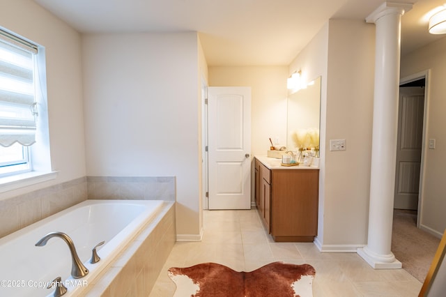 full bathroom featuring decorative columns, tile patterned floors, vanity, and a bath
