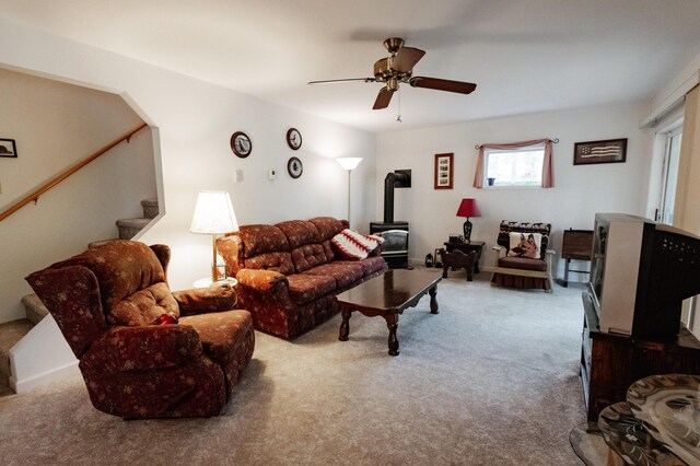 20 Horseshoe Dr, White Haven, PA 18661 - carpeted living room featuring a wood stove, stairs, and a ceiling fan