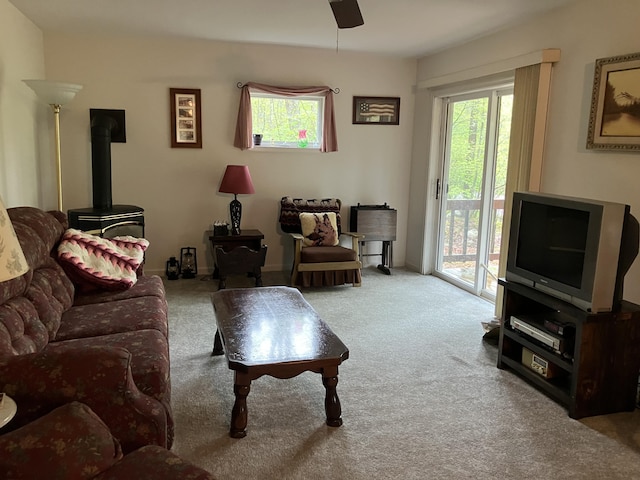 20 Horseshoe Dr, White Haven, PA 18661 - living area featuring a wood stove, carpet, plenty of natural light, and a ceiling fan
