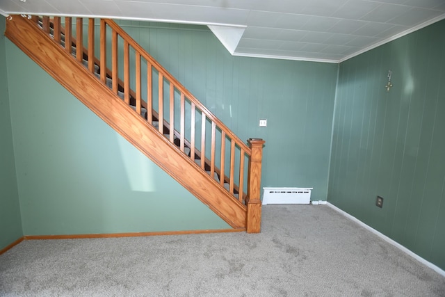 staircase with carpet floors, a baseboard radiator, and baseboards