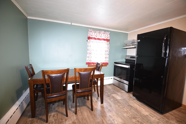 dining room with a baseboard radiator, crown molding, and wood finished floors