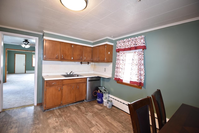 kitchen with brown cabinetry, light countertops, dishwasher, and a sink