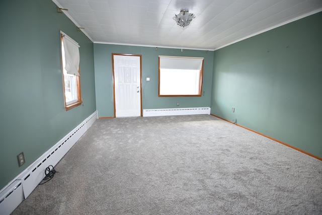 spare room with ornamental molding, carpet, baseboards, and baseboard heating