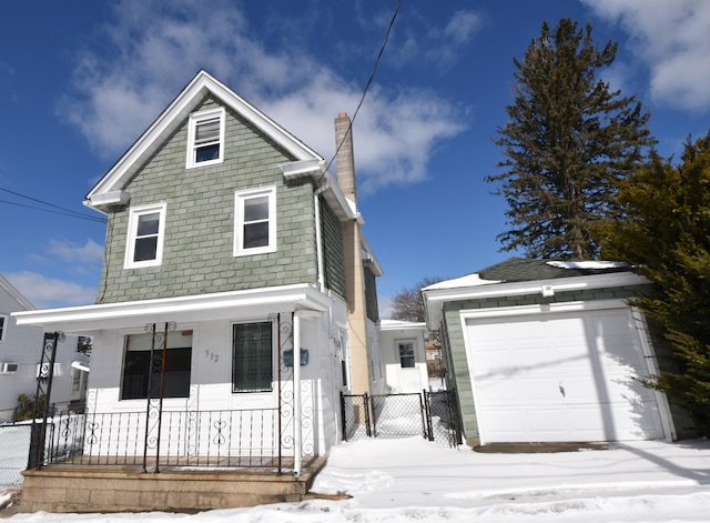 view of front facade featuring an outbuilding, covered porch, fence, and a chimney