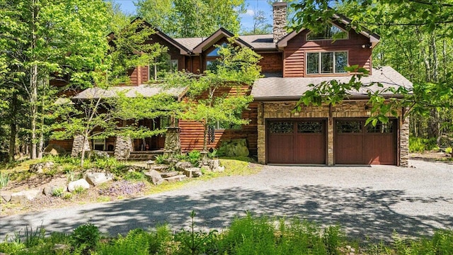 44 Watawga Way W, Gouldsboro, PA 18424 - log cabin featuring driveway, a chimney, a garage, and stone siding