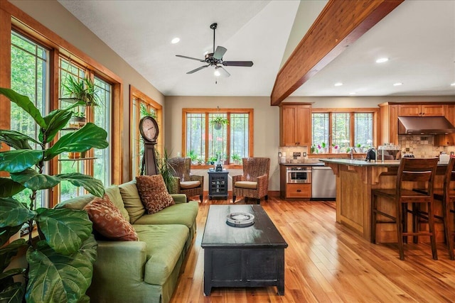 44 Watawga Way W, Gouldsboro, PA 18424 - living area with light wood finished floors, ceiling fan, recessed lighting, a wood stove, and lofted ceiling