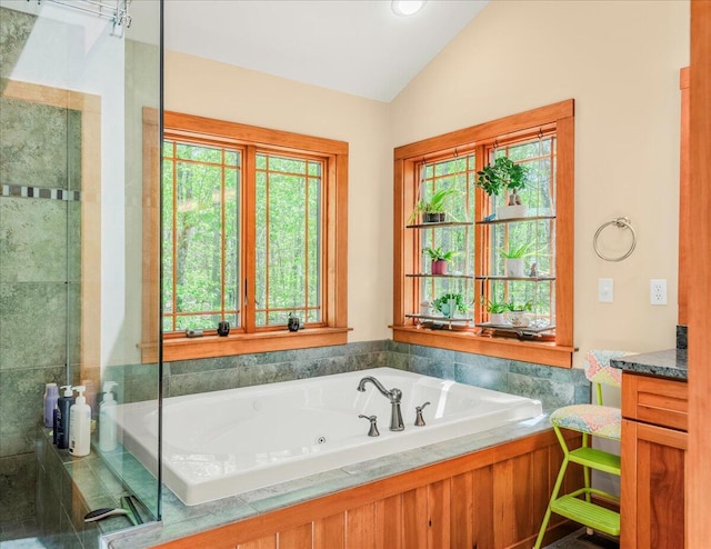 44 Watawga Way W, Gouldsboro, PA 18424 - full bathroom with lofted ceiling, a jetted tub, vanity, and a stall shower