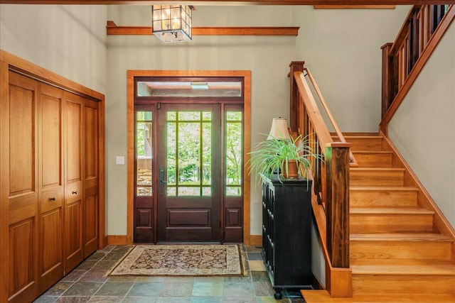 44 Watawga Way W, Gouldsboro, PA 18424 - entryway with stairway, dark stone finish floors, baseboards, and a chandelier