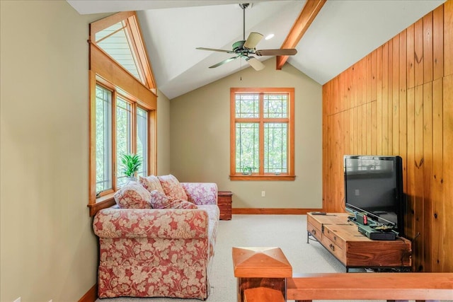44 Watawga Way W, Gouldsboro, PA 18424 - living room featuring plenty of natural light, ceiling fan, baseboards, wood walls, and carpet floors