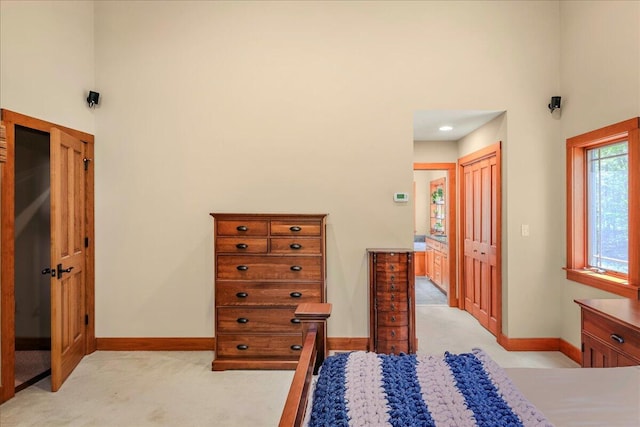44 Watawga Way W, Gouldsboro, PA 18424 - bedroom with light carpet, baseboards, a high ceiling, and a closet