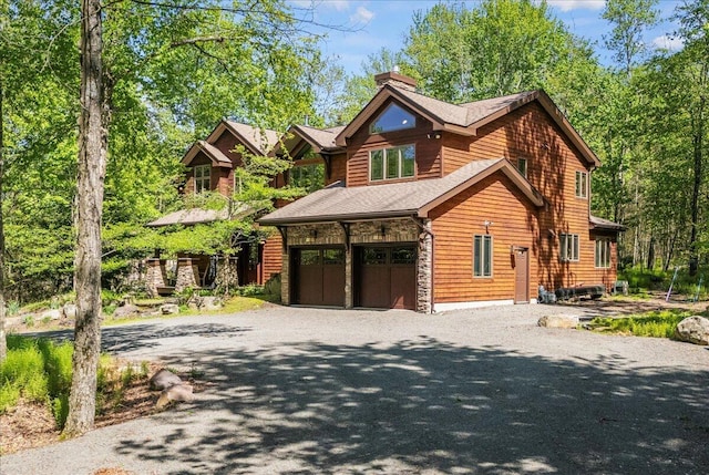 44 Watawga Way W, Gouldsboro, PA 18424 - log cabin featuring a chimney, driveway, and an attached garage