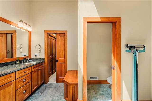 44 Watawga Way W, Gouldsboro, PA 18424 - full bath featuring vanity, toilet, baseboards, and stone finish floors
